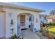 Inviting front porch adorned with nautical accents and a cozy seating area, perfect for relaxing at 1181 Southland Rd, Venice, FL 34293