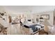 Bright open-concept living area with tile floors and comfortable seating at 1181 Southland Rd, Venice, FL 34293