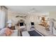 Open living area with tiled floors seamlessly connects to dining space with bright light at 1181 Southland Rd, Venice, FL 34293