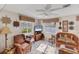 Comfortable living room featuring tile floors, plenty of seating, and bright windows at 1181 Southland Rd, Venice, FL 34293