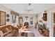 Relaxing living space with woven furniture, ceiling fan, and sunlit room at 1181 Southland Rd, Venice, FL 34293