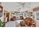 Cozy living room with tile flooring, comfortable seating, and multiple windows for natural light at 1181 Southland Rd, Venice, FL 34293