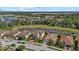 Aerial view of community featuring beautiful homes surrounding a scenic lake at 12279 Canavese Ln, Venice, FL 34293