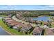 Community view featuring beautiful homes surrounding scenic lakes and winding roads at 12279 Canavese Ln, Venice, FL 34293