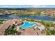 Aerial view of a large community pool and clubhouse, perfect for recreation at 12279 Canavese Ln, Venice, FL 34293