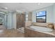 Bathroom featuring a soaking tub and a shower at 12279 Canavese Ln, Venice, FL 34293