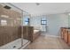 Spacious bathroom features a tiled shower and a soaking tub at 12279 Canavese Ln, Venice, FL 34293