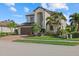 Stunning two-story home with lush tropical landscaping and a barrel tile roof at 12279 Canavese Ln, Venice, FL 34293