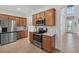 Well-equipped kitchen with stainless steel appliances and plenty of cabinet space at 12279 Canavese Ln, Venice, FL 34293