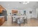 Bright, open kitchen with a large island, stainless steel appliances, and barstool seating at 12279 Canavese Ln, Venice, FL 34293