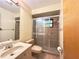 Bathroom featuring a shower with glass doors, sink and vanity at 12321 Alta Mira St, North Port, FL 34287