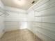 Large walk-in closet with shelving for optimal storage and organization at 12321 Alta Mira St, North Port, FL 34287