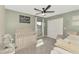 Charming Bedroom with a crib, changing table, and soft decor at 12410 Cinqueterre Dr, Venice, FL 34293