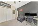 Bedroom/office space with comfortable seating and modern desk setup at 12410 Cinqueterre Dr, Venice, FL 34293