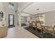 Elegant foyer featuring tile flooring, dining room and living room views, and an arched entryway at 12410 Cinqueterre Dr, Venice, FL 34293