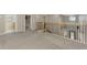 Carpeted upstairs landing with views to the foyer, stairwell and other rooms at 12410 Cinqueterre Dr, Venice, FL 34293