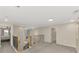 Open upstairs landing area with new carpet and decorative wrought iron railing at 12410 Cinqueterre Dr, Venice, FL 34293