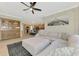Open layout showing living room with a comfortable sectional sofa and open flow to the kitchen at 12410 Cinqueterre Dr, Venice, FL 34293