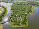 Aerial view of the walking trails and playground on an island in the community lake at 12505 Palatka Dr, Venice, FL 34293