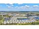 Wide aerial shot showcasing the layout of the residential community with ponds and landscaping at 12505 Palatka Dr, Venice, FL 34293