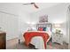 Bedroom featuring neutral colors, closet, ceiling fan, and bedside tables at 12505 Palatka Dr, Venice, FL 34293