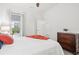 Bedroom featuring neutral colors, with hard wood dresser and bedside tables at 12505 Palatka Dr, Venice, FL 34293