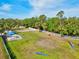 Aerial view of the fenced dog park with agility equipment and seating area at 12505 Palatka Dr, Venice, FL 34293