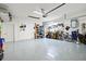 Spacious garage featuring epoxy floors and organizational systems offers ample storage and workspace at 12505 Palatka Dr, Venice, FL 34293