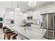Bright, modern kitchen featuring a large island and stainless steel appliances at 12505 Palatka Dr, Venice, FL 34293