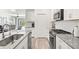 Modern kitchen with stainless steel appliances and ample counter space at 12505 Palatka Dr, Venice, FL 34293