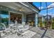 Charming screened-in patio connects indoor living with serene outdoor space, ideal for relaxing and entertaining at 12505 Palatka Dr, Venice, FL 34293