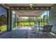 Relaxing screened patio overlooking the lush greenery provides a serene outdoor living space at 12505 Palatka Dr, Venice, FL 34293