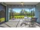 Relaxing screened patio overlooking the lush greenery provides a serene outdoor living space at 12505 Palatka Dr, Venice, FL 34293