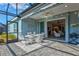 Charming screened-in patio connects indoor living with serene outdoor space, ideal for relaxing and entertaining at 12505 Palatka Dr, Venice, FL 34293