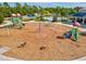 View of community playground area featuring slides, climbing structures and picnic shelter at 12505 Palatka Dr, Venice, FL 34293