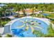 Overhead view of splash pad with colorful banana-themed fountains and covered seating at 12505 Palatka Dr, Venice, FL 34293