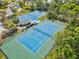 Overhead shot of the community's well-maintained blue and green tennis courts at 12505 Palatka Dr, Venice, FL 34293