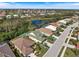 Beautiful aerial view of property with surrounding neighborhood, lake, and golf course at 1298 Highland Greens Dr, Venice, FL 34285