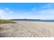 A ground level view of the beach and Venice Fishing Pier on a sunny day with a clear sky at 1298 Highland Greens Dr, Venice, FL 34285
