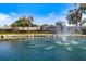 Tranquil water feature with the Pelican Pointe Golf and Country Club signage at 1298 Highland Greens Dr, Venice, FL 34285