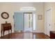 Welcoming foyer with hardwood floors, transom window, and space to greet your guests at 1298 Highland Greens Dr, Venice, FL 34285