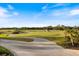 Picturesque golf course view showcasing the lush green fairway and landscaping at 1298 Highland Greens Dr, Venice, FL 34285