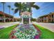 Welcome to Venice sign, the median is planted with colorful flowers with palms in background at 1298 Highland Greens Dr, Venice, FL 34285
