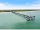 A scenic view of the long pier extending into the ocean, great for fishing and sightseeing at 1298 Highland Greens Dr, Venice, FL 34285