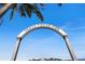 An archway sign for the Venice Fishing Pier on a clear day with bright blue skies overhead at 1298 Highland Greens Dr, Venice, FL 34285