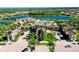 Aerial view of the neighborhood entrance showcasing the beautiful landscaping and architecture at 13238 Famiglia Dr, Venice, FL 34293