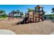 Community playground with various play structures for children at 13238 Famiglia Dr, Venice, FL 34293