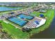The tennis and pickleball courts are surrounded by lounge chairs for relaxation at 13278 Huerta St, Venice, FL 34293
