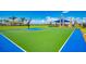 Community basketball court with blue and green surface and palm trees at 13278 Huerta St, Venice, FL 34293