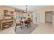 Bright dining room with wooden table, a large window with shutters, and decorative accents for an inviting space at 13278 Huerta St, Venice, FL 34293